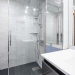 A,Small,Bathroom,With,A,Black,Wood,Cabinet,With,Drawers,