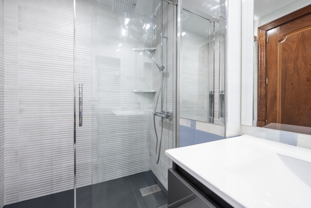 A,Small,Bathroom,With,A,Black,Wood,Cabinet,With,Drawers,